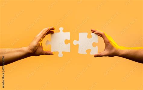 Closeup Hand Of Connecting Jigsaw Puzzle Business Solutions Success