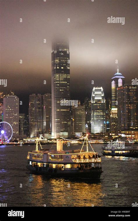 Hong Kong Ferry and Skyline at night Stock Photo - Alamy