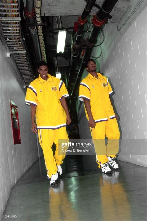 Kobe Bryant And Eddie Jones Of The Los Angeles Lakers Walk In The