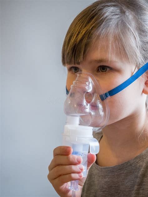 Child Making Inhalation With Mask On His Face Asthma Problems Concept