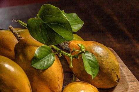 Premium Photo Close Up Of Passion Fruits On Table