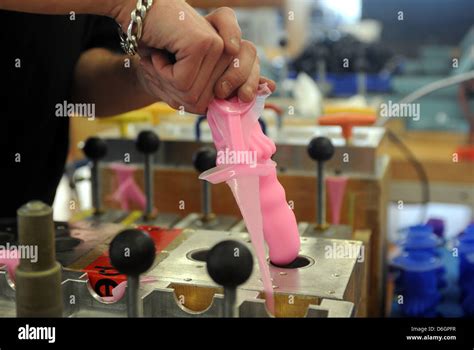 An Employees Pulls A Silicon Dildo Out Of The Mold At The Fun Factory In Bremen Germany 17
