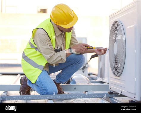 Air Conditioning Technician Or Engineer On Roof For Maintenance Building Or Construction Of