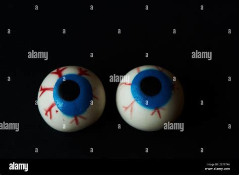 Two Hallloween Scary Eyeballs On Black Background Stock Photo Alamy