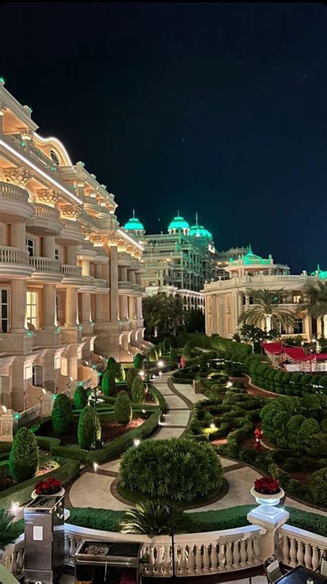 An Elaborately Decorated Building In The Middle Of A City At Night With