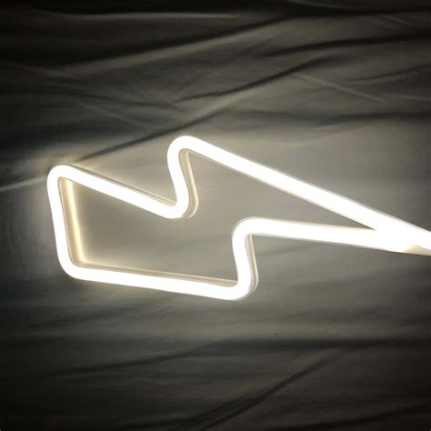 Download A White Neon Sign With A Lightning Bolt On It Wallpaper ...