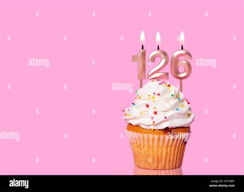 Birthday Cake With Candle Number On Pink Background Stock Photo