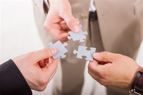 Group Of Business People Assembling Jigsaw Puzzle Stock Image Image