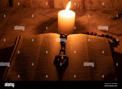 Holy Bible Rosary And Candle Stock Photo Alamy