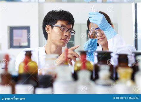 Two Asian Laboratory Scientist Working At Lab With Test Tubes Stock