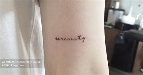 Tattoo Of The Word Serenity Located On The Tricep