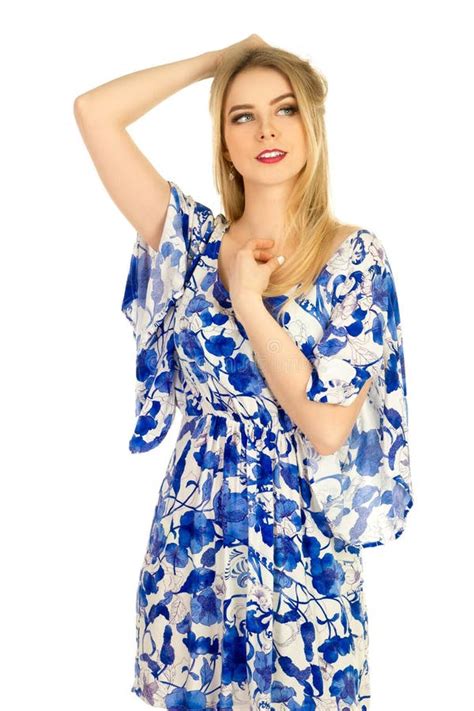 Blonde Posing In Blue Dress With A Floral Pattern Stock Photo Image
