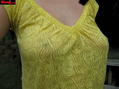 Amazing Brunette Babe Shows Her Hard Nipples Under A Yellow Shirt 15 Photos