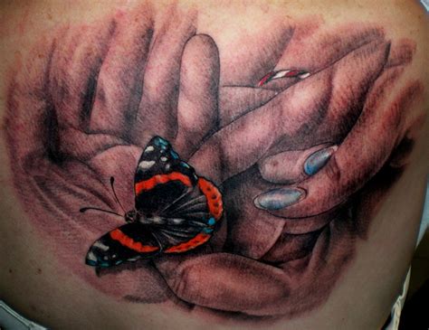 Hands Holding A Monarch Butterfly By Daniel Rosini TattooNOW