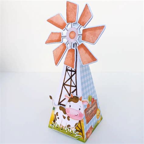 An Origami Model Of A Windmill With A Cow On It