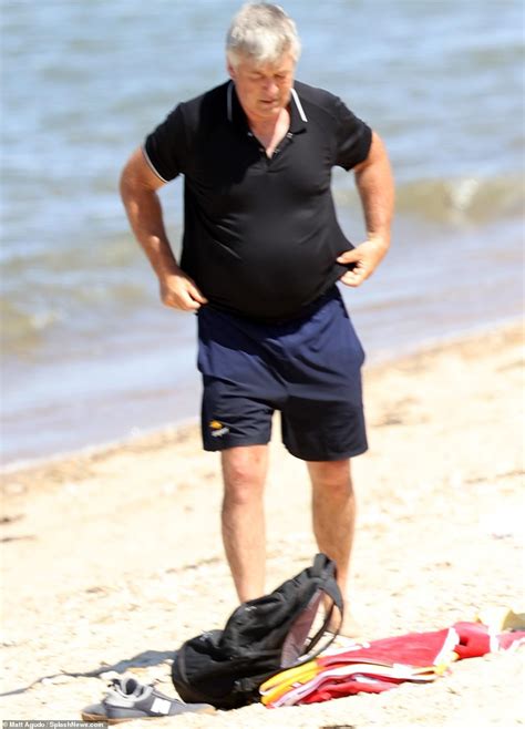 Alec Baldwin Shows Off Shirtless Physique As He Frolics Across The