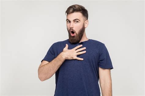 Premium Photo Indignation Man Looking At Camera With Shocked Face