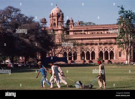 Mowing the lawns at Aitchison College, a famous independent semi ...