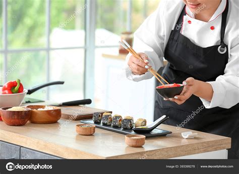 Beautiful Asian Chef Cooking Kitchen — Stock Photo © serezniy #393399278