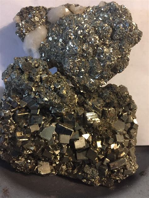 Iron pyrite & iron pyrite w calcite : r/rockhounds