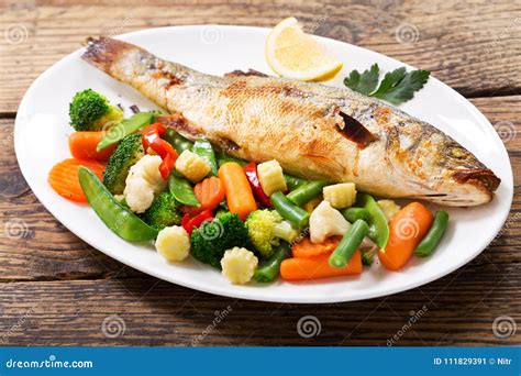 Plate Of Baked Fish With Vegetables Stock Image Image Of Grilled