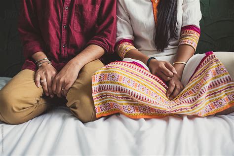 Indian Couple Sitting Together Del Colaborador De Stocksy Lumina