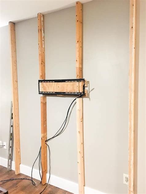 An Electrical Outlet In The Corner Of A Room Being Built With Wooden