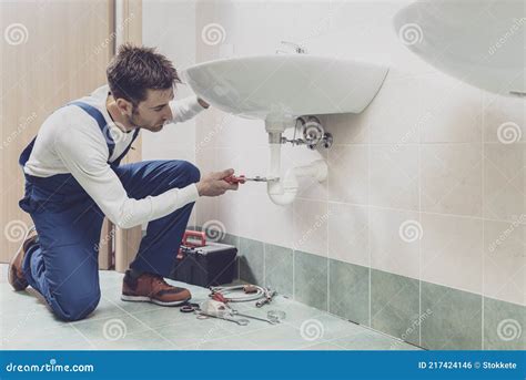 Plumber Fixing A Sink At Home Stock Photo Image Of Repairing Sink