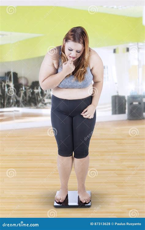 Fat Woman On Scale Women Have More Fat Because Of Physiological