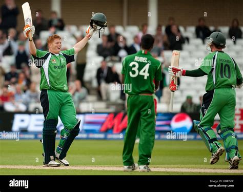 Sport Cricket Celebrating Full Length Bat Raised Hi Res Stock