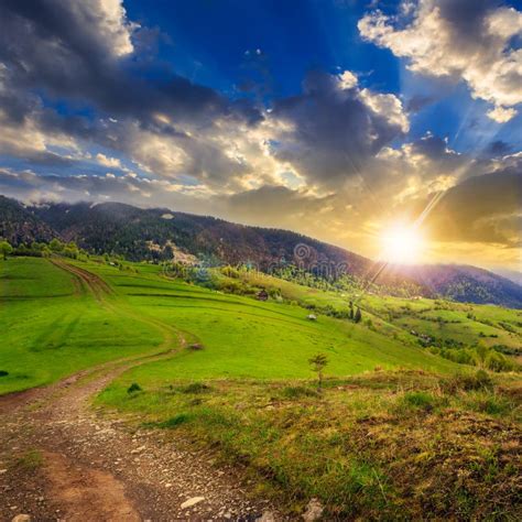 Path On Hillside Meadow In Mountain At Sunset Stock Photo Image Of