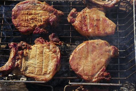 Grilled Pork Steaks Lay Over Coals On A Grill Stock Photo Image Of