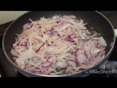 Onions Being Cooked In A Pan On The Stove