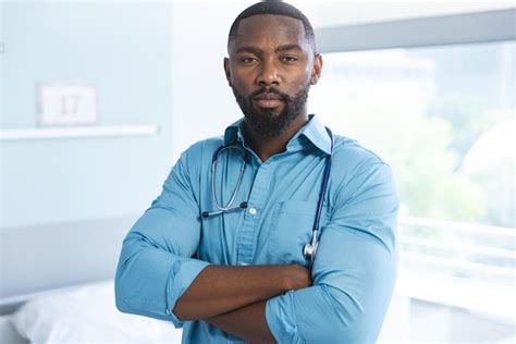 Premium Photo Portrait Of Happy African American Male Doctor Wearing