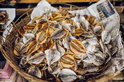 "Fish Dry On Basket In An Asian Market" by Stocksy Contributor "Blue Collectors" - Stocksy