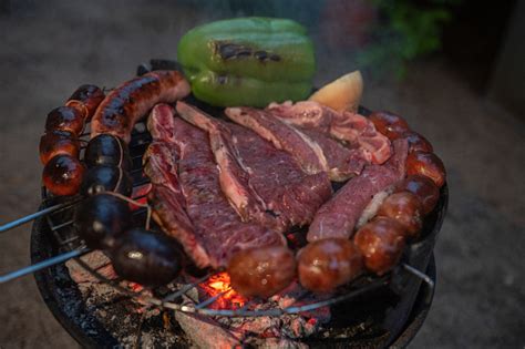 Typical Uruguayan And Argentine Asado Cooked On Fire Entrana And Vacio