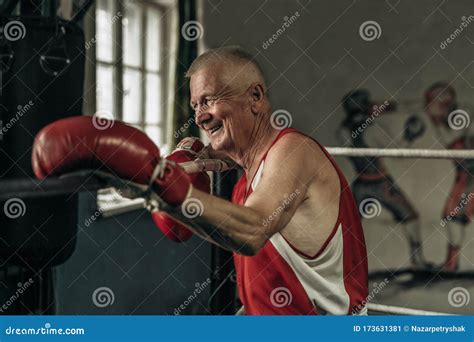 Old Boxer Practicing Her Punches At A Boxing Studio Close Up Of A Male