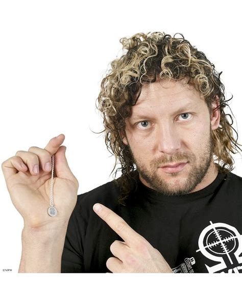 A Man With Curly Hair Pointing At The Camera