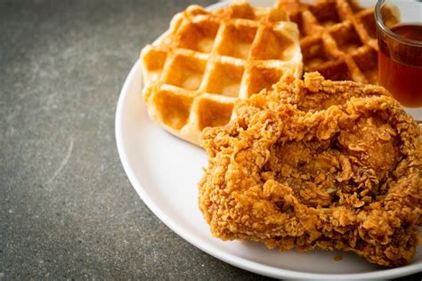 Premium Photo Fried Chicken Waffle With Honey Or Maple Syrup