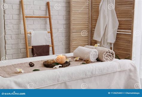 Massage Table With Towels Candle And Sea Salt In Spa Salon Stock Image