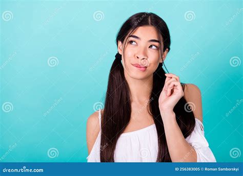 Portrait Of Minded Adorable Cute Lady Bite Lips Playing Hair Look Empty Space Isolated On