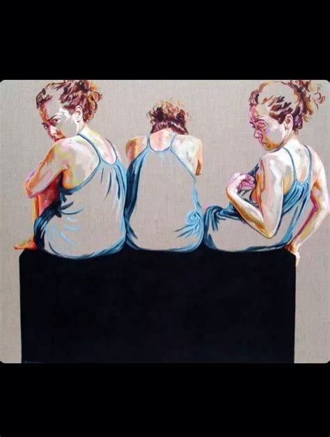 Three Women Sitting On Top Of A Black Box With Their Backs Turned To