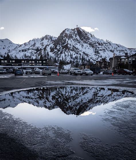 Sierra Nevada Mountains Against Blue Sky With Visible Reflection On The