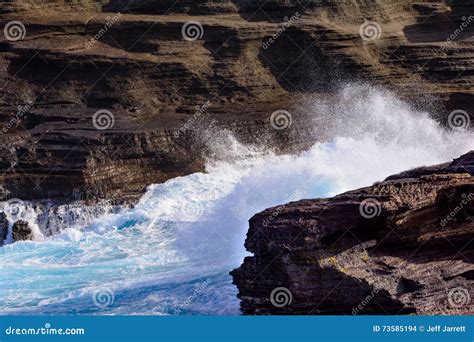 Ocean Waves Crashing Against Rocks And Cliffs With White Foam Cl Stock