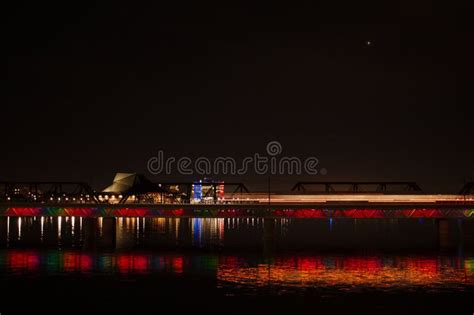 The Bridge At Tempe Town Lake At Night Pictured A Moving Light Rail