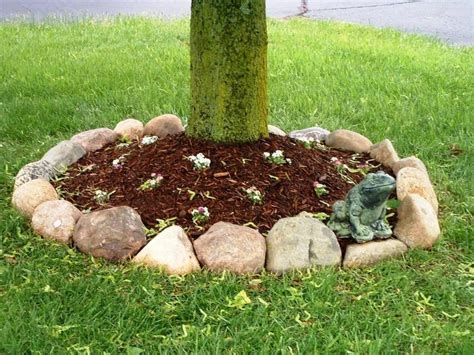 Rock Border Around Trees In The Very Front Of The House In Front Of