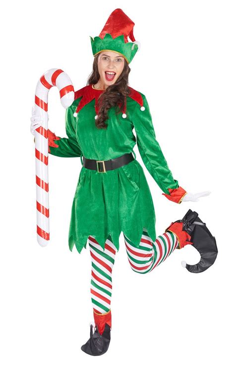 A Woman Dressed In An Elf Costume Holding A Candy Cane