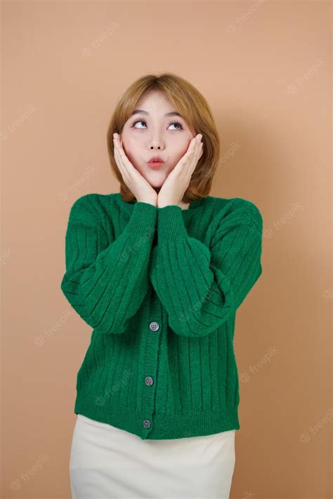 Premium Photo Surprised Happy Beautiful Woman Looking Sideways In Excitement Isolated On Beige