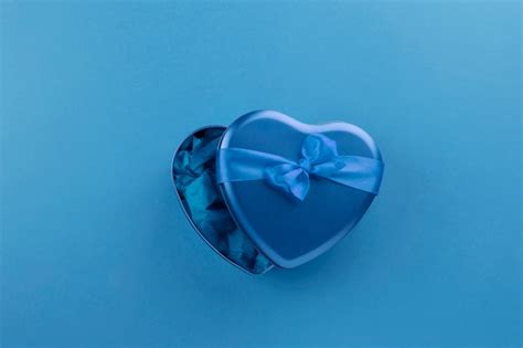 Premium Photo Blue Heart Shaped Box With Ribbon On Blue Background