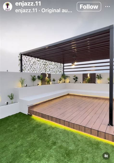 An Outdoor Area With Grass And Wooden Decking